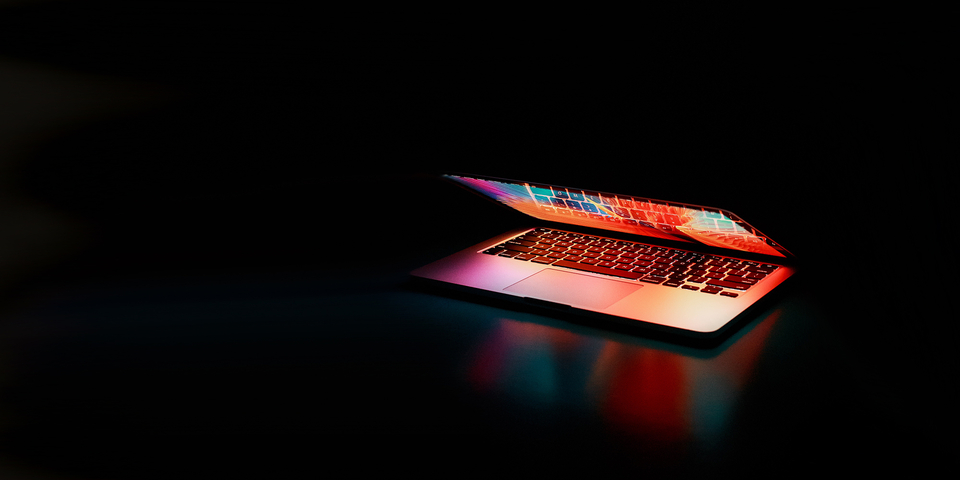 Open-laptop-and-dark-background